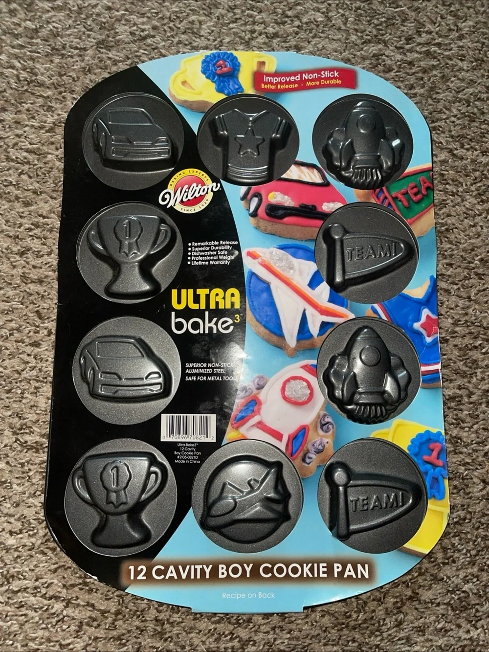 Wilton Ultra Bake 12-Cavity Boy Cookie Pan - Black and Blue Packaging